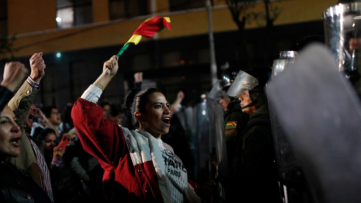 Supporters of opposition presidential candidate Carlos Mesa protest outside the Supreme Electoral Court where election ballots are being counted in La Paz, Bolivia, Monday, Oct. 21, 2019.