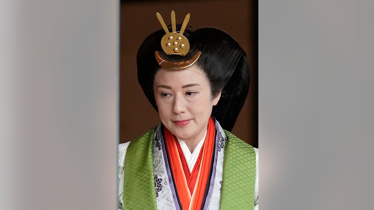 Japanese Empress Masako leaves the ceremony hall after Emperor Naruhito proclaimed his enthronement at the Imperial Palace in Tokyo, Tuesday, Oct. 22, 2019. (Kimimasa Mayama/Pool Photo via AP)