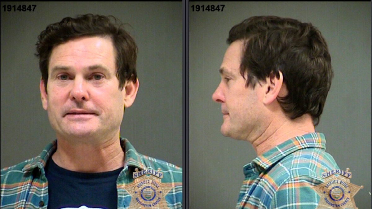 This image provided by the Washington County Sheriff's Office shows booking photos of actor Henry Thomas. Authorities say Thomas, the actor who starred as a child in "E.T. the Extra Terrestrial," was arrested for driving under the influence in Oregon. The 48-year-old was booked into the Washington County Jail and faces the misdemeanor charge after police said they found him Monday in a stationary car. 