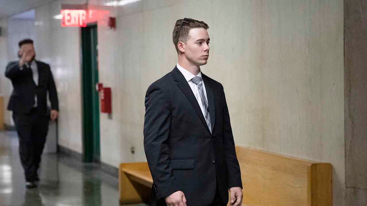 In this July 31, 2019, file photo, Maxwell Hare, center, and John Kinsman, back left, arrive at court during their trial in New York. The members of the far-right Proud Boys have each been sentenced to four years in prison for their part in a street fight that followed a speech last year at New York's Metropolitan Republican Club. (AP Photo/Mark Lennihan, File)