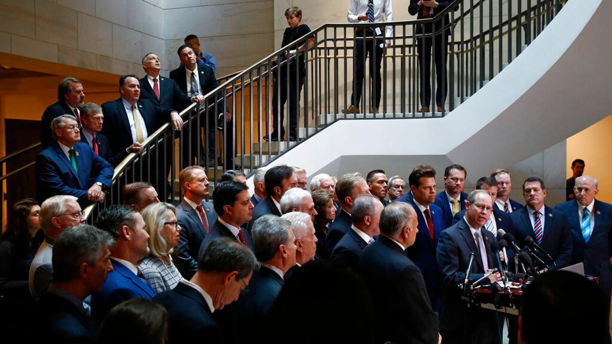 House Republicans gather for a news conference after Deputy Assistant Secretary of Defense Laura Cooper arrived for a closed door meeting to testify as part of the House impeachment inquiry into President Donald Trump, Wednesday, Oct. 23, 2019, on Capitol Hill in Washington. (AP Photo/Patrick Semansky)