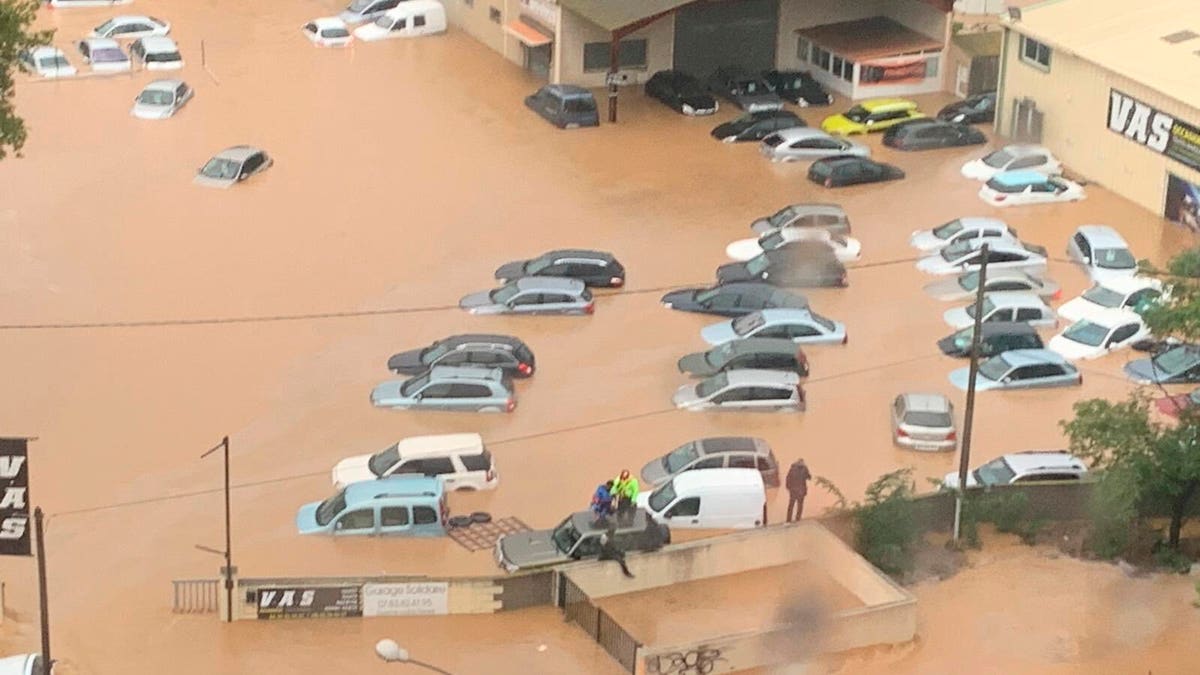 This Oct. 23, 2019 image made by Twitter user @SDIS34 shows cars flooded in the southern France. France's Interior ministry says three people have been killed in torrential rains that flooded towns and villages in southern France this week.