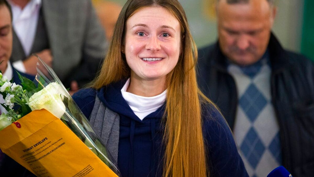 Russian agent Maria Butina smiles as she speaks to journalists upon her arrival from the United States at Moscow International Airport Sheremetyevo outside Moscow Moscow, Russia, Saturday, Oct. 26, 2019.