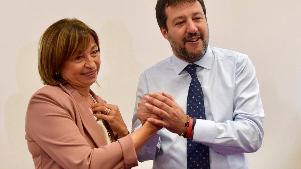 Centre-right coalition candidate for governor of Umbria Region Donatella Tesei celebrates her victory with secretary of League party Matteo Salvini in Perugia, Italy, Oct. 28, 2019. (Matteo Crocchioni/ANSA via AP)