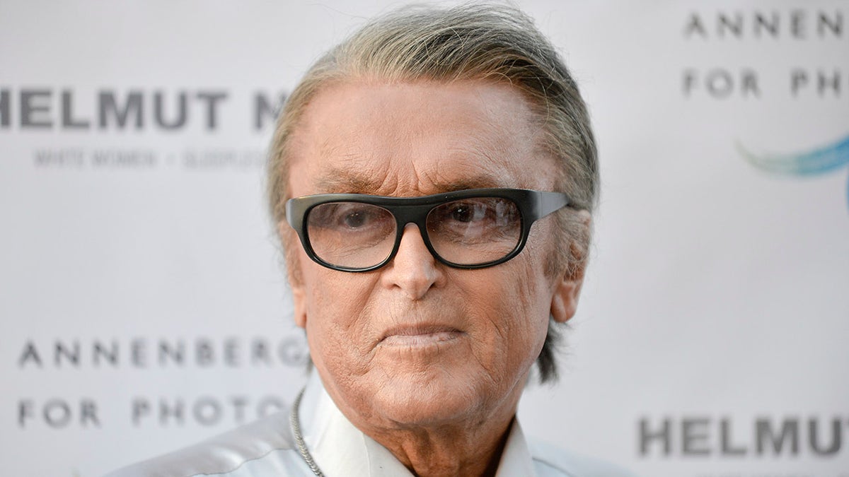 This June 27, 2013 File photo shows Robert Evans at "Helmut Newton: White Women - Sleepless Nights - Big Nudes" exhibit opening at the Annenberg Space Photography in Los Angeles.