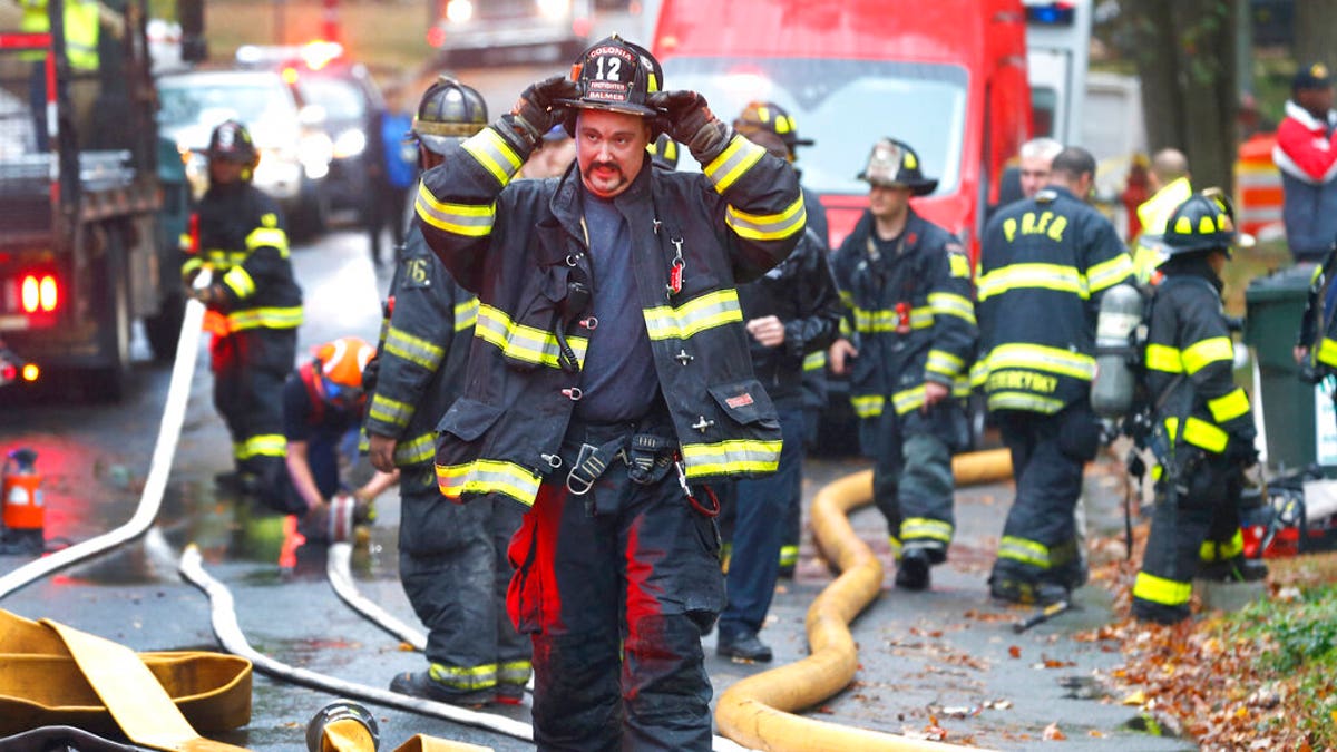 Fire destroyed one home and damaged two others. (AP Photo/Noah K. Murray)