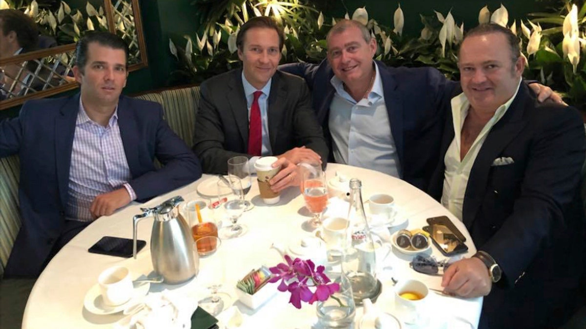 This Facebook screen shot provided by The Campaign Legal Center, shows from left, Donald Trump, Jr., Tommy Hicks, Jr., Lev Parnas and Igor Fruman, posted on May 21, 2018. (The Campaign Legal Center via AP)
