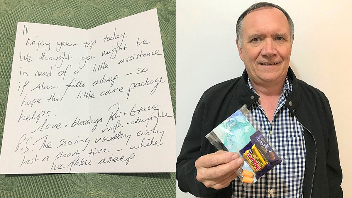 Alan Tattersall holds a care package made for him by his wife and stepdaughter. The little packages also contained notes for his fellow airline passengers.