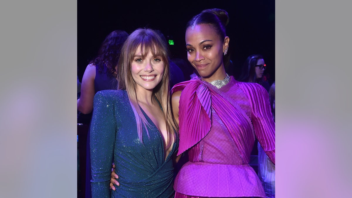 Elizabeth Olsen and Zoe Saldana attend the Los Angeles World Premiere of Marvel Studios' "Avengers: Endgame" at the Los Angeles Convention Center on April 23, 2019, in Los Angeles, California.