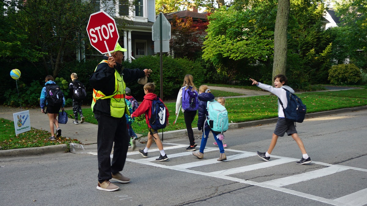 Every morning, Alec Childress, a crossing guard in Wilmette, Ill., tells kids with a big smile, "Peace, I gotcha!"