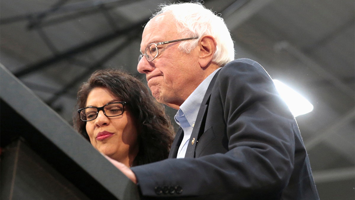 Democratic 2020 U.S. presidential candidate Senator Bernie Sanders and Rep. Rashida Tlaib address the audience during a Sanders campaign rally in Detroit, Michigan. (REUTERS/Rebecca Cook)