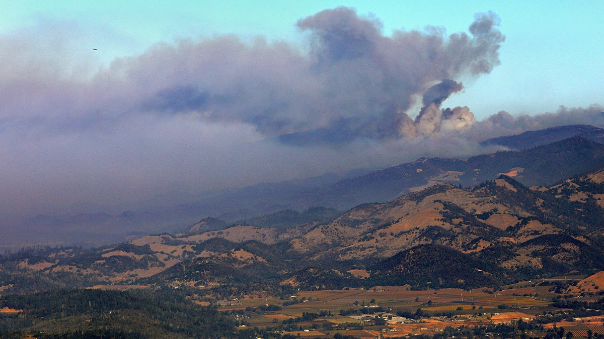 A smoke plume from the Kincade Fire is seen just north of Mt. Saint Helena, Calif., Tuesday, Oct. 29, 2019.