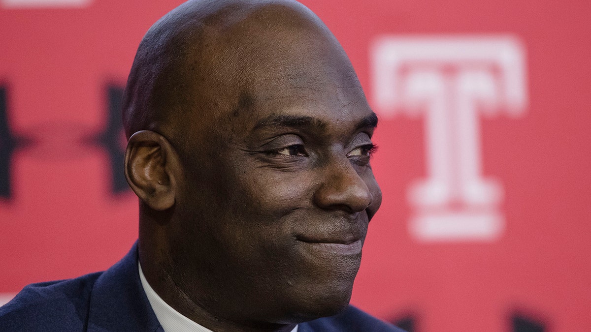 FILE - In this April 2, 2019, file photo Temple NCAA college basketball coach Aaron McKie listens to his introduction during a news conference in Philadelphia. McKie is just the third head coach for Temple since Hall of Famer John Chaney was hired in 1982. (AP Photo/Matt Rourke, File)