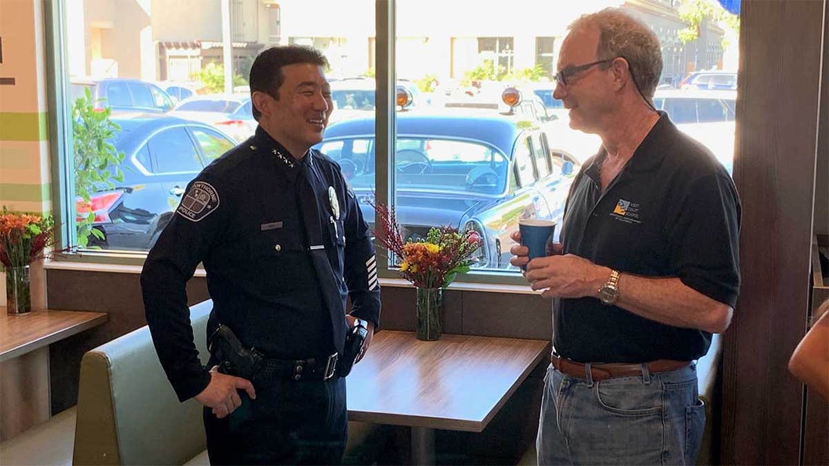 An officer is seen at a McDonald's in Hawthorne, Calif., on 2019's National Coffee With a Cop Day.