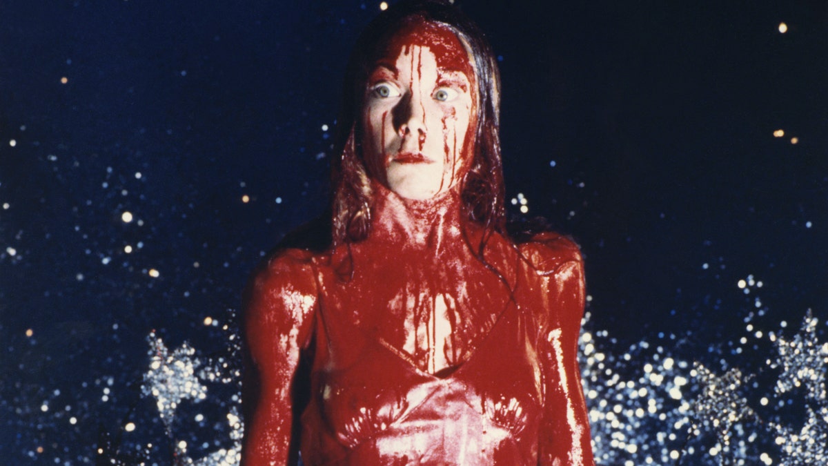 In the musical, Wolfe plays the titular role of Carrie White, made famous by Sissy Spacek in the 1976 film (pictured above), and was dressed as Carrie during the climactic scene – prom dress, tiara and tons of fake blood.