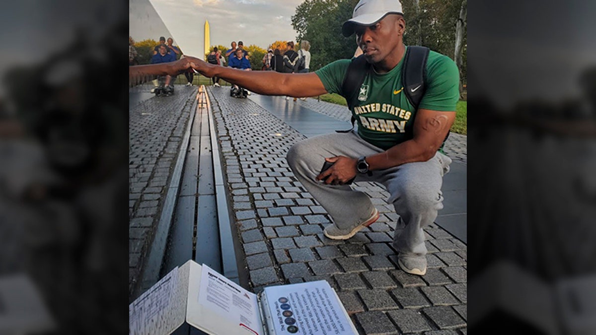 Moss at the Vietnam Veterans Memorial Wall with his family in Washington, D.C. (U.S. Army Reserve photo by Sgt. 1st Class Javier Orona)