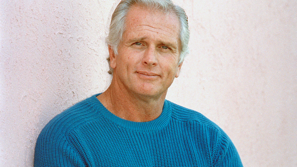 FILE - This Dec. 28, 1987 file photo shows former “Tarzan” actor Ron Ely during an interview in Los Angeles. (AP Photo/Reed Saxon, File)