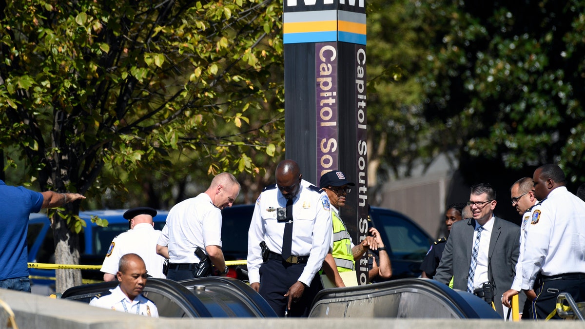 Officers respond to Friday's stabbing at the Capitol South Metro station. (AP Photo/Susan Walsh)