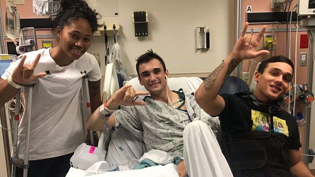 Sgt. Aechere Crump and Pfc. Victor Alamo visit with Spc. Ezra Maes during their recovery at Brooke Army Medical Center. Crump and Alamo survived the tank accident with Maes in early 2018. (Courtesy Photo)