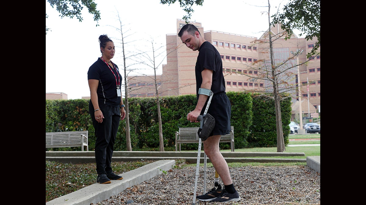 Candace Pellock, physical therapy assistant, with Spc. Ezra Maes at the Center for the Intrepid. (U.S. Army photo by Corey Toye)