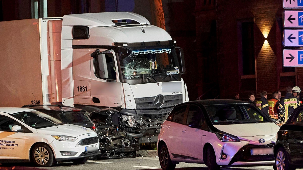 In this Monday, Oct. 7, 2019 photo s truck stands between damaged cars in Limburg, Germany.