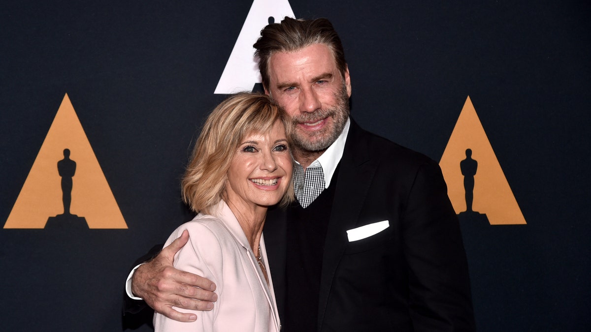 Olivia Newton-John starred in "Grease" alongside Kelly Preston's husband, John Travolta. The actress says the two are still in touch.