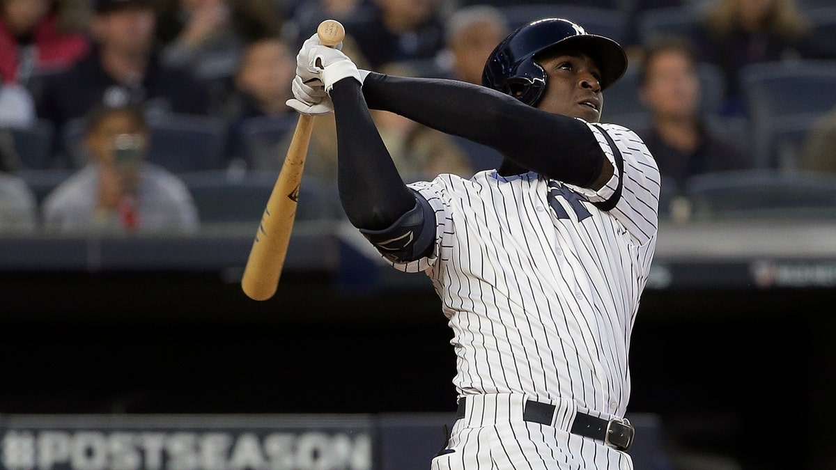 New York Yankees' Didi Gregorius follows through on his third-inning grand slam Saturday. (AP Photo/Seth Wenig)