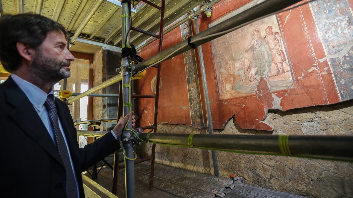 The Italian Minister for Cultural Heritage, Dario Franceschini, admires one of the frescoes inside the house of the bicentennial. (Photo by Marco Cantile/LightRocket via Getty Images)