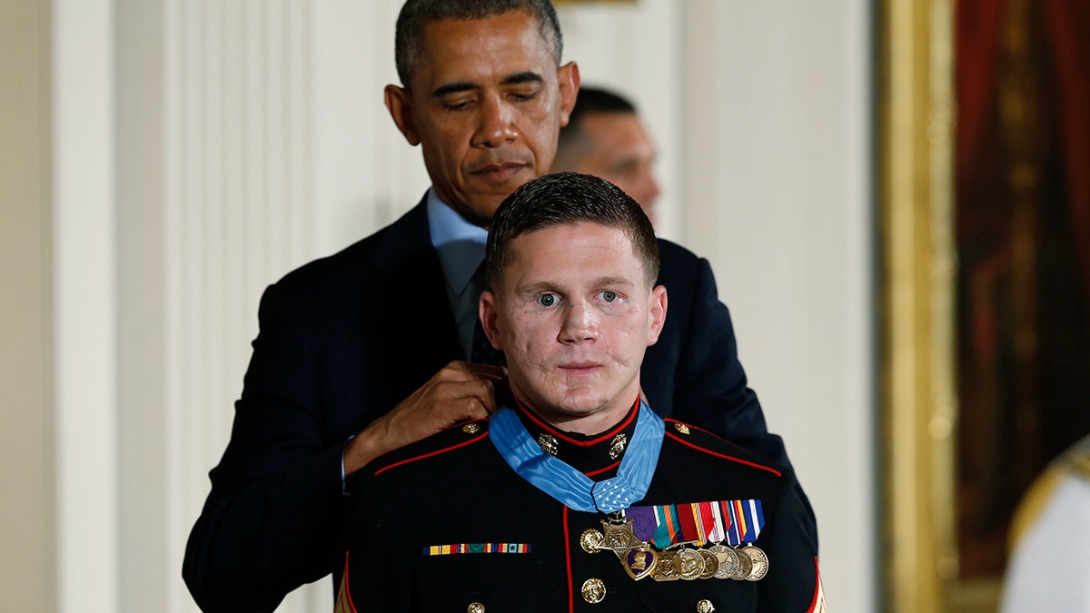 FILE - Retired Marine Cpl. William "Kyle" Carpenter receives the Medal of Honor from U.S. President Barack Obama during a Medal of Honor ceremony in the East Room of the White House on June 19, 2014 in Washington, DC. Carpenter received the medal for taking the blast from a grenade to protect fellow Marines and sustained major wounds. Carpenter is the eighth living recipient chosen for the high honor.