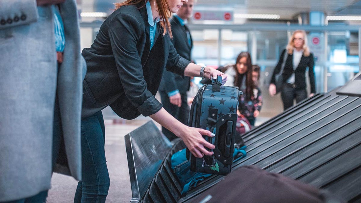 Luggage gets picked up by conveyor belt