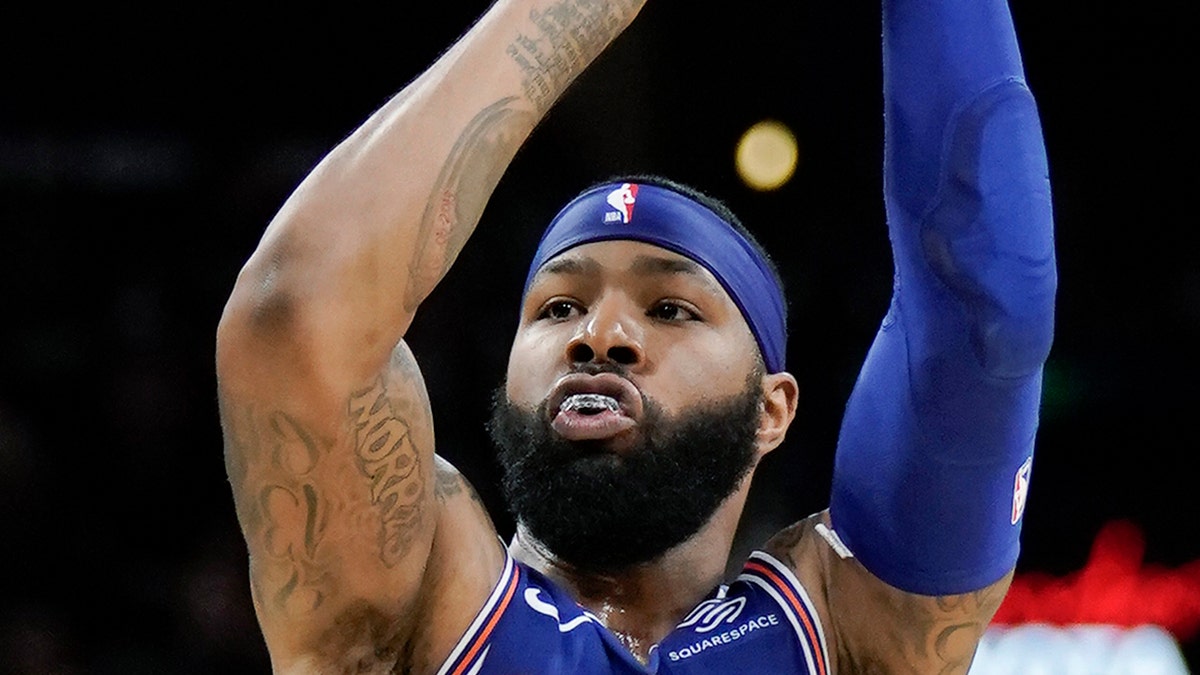 New York Knicks forward Marcus Morris shoots during the first half of the team's NBA basketball game against the San Antonio Spurs, Wednesday, Oct. 23, 2019, in San Antonio. San Antonio won 120-111. (AP Photo/Darren Abate)