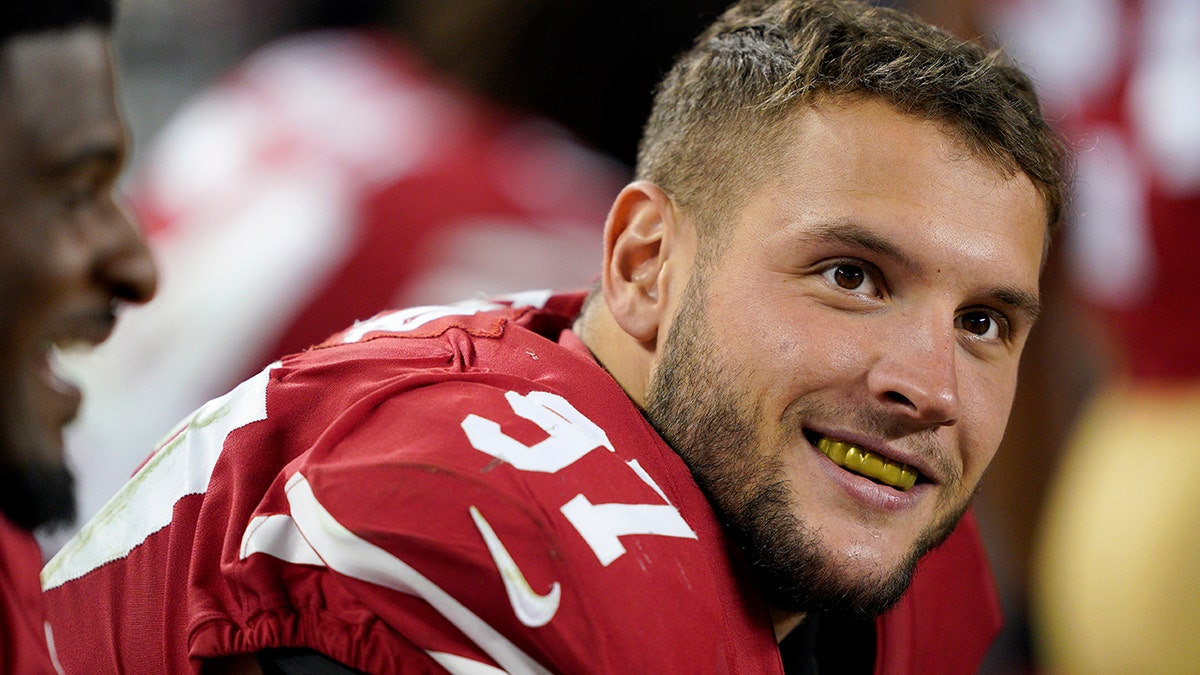 San Francisco 49ers defensive end Nick Bosa (97) smiles on the sideline during the second half of an NFL football game against the Cleveland Browns in Santa Clara, Calif., Monday, Oct. 7, 2019. (AP Photo/Tony Avelar)