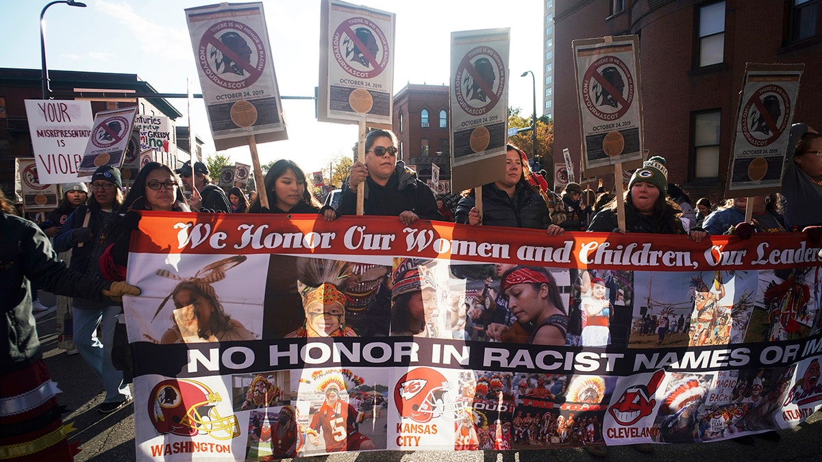 Protesters march from Peavey Park to US Bank Stadium to protest the use of "Redskins" in the name of the Washington NFL football team, and the names of some other pro sports teams, before Washington's game against the Minnesota Vikings on Thursday, Oct. 24, 2019, in Minneapolis.