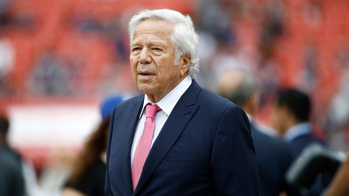 New England Patriots owner Robert Kraft walks the turf ahead of an NFL football game between the Washington Redskins and the New England Patriots, Sunday, Oct. 6, 2019, in Washington.