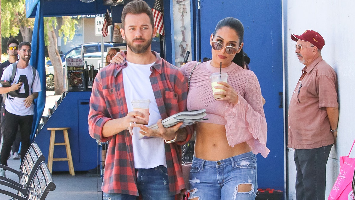 Nikki Bella puts on a busty display in triple denim outfit as she promotes  her show Barmaggedon