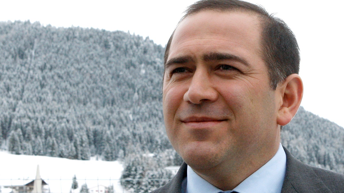 FILE - In this Jan. 26, 2011 file photo Akhmed Bilalov speaks with The Associated Press on the sidelines of the World Economic Forum in Davos, Switzerland. Bilalov, a former Russian Olympic Committee official, who fled the country following accusations by President Vladimir Putin was arrested Tuesday, Oct. 22, 2019, at his home in Sunny Isles, Fla., on an alleged immigration violation. (AP Photo/Michel Euler, File)