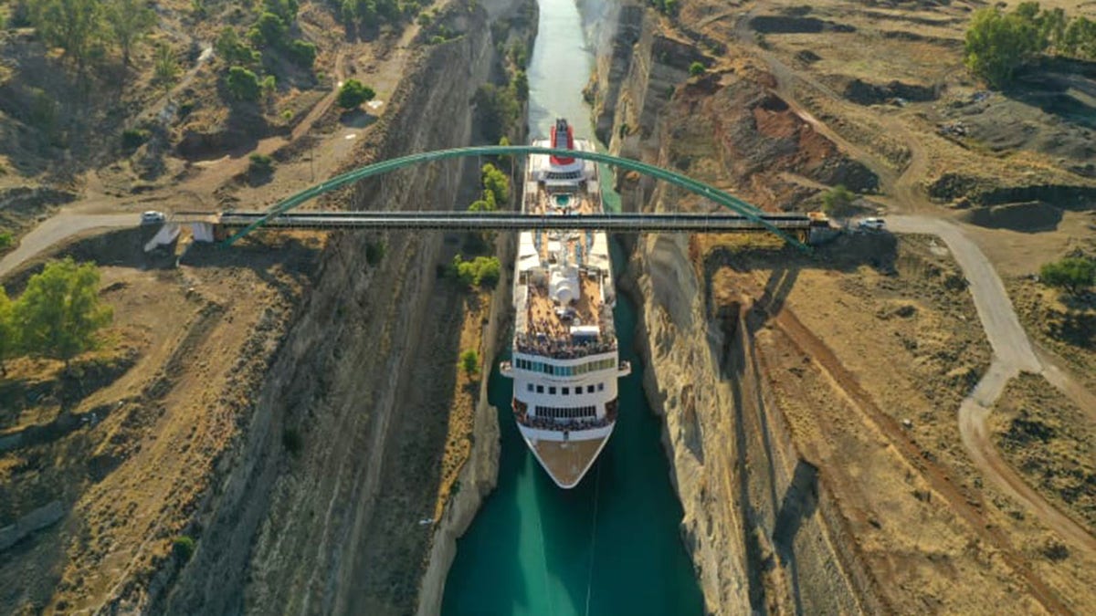 A 74-foot wide cruise ship impressively, safely passed through a historic Greek canal measuring 78-feet wide at its narrowest point last week, becoming the largest vessel to ever pass through the precarious passageway.