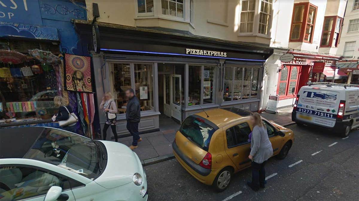 The protest, which took place inside a Pizza Express in Brighton, was one of several across the city, according to authorities.
