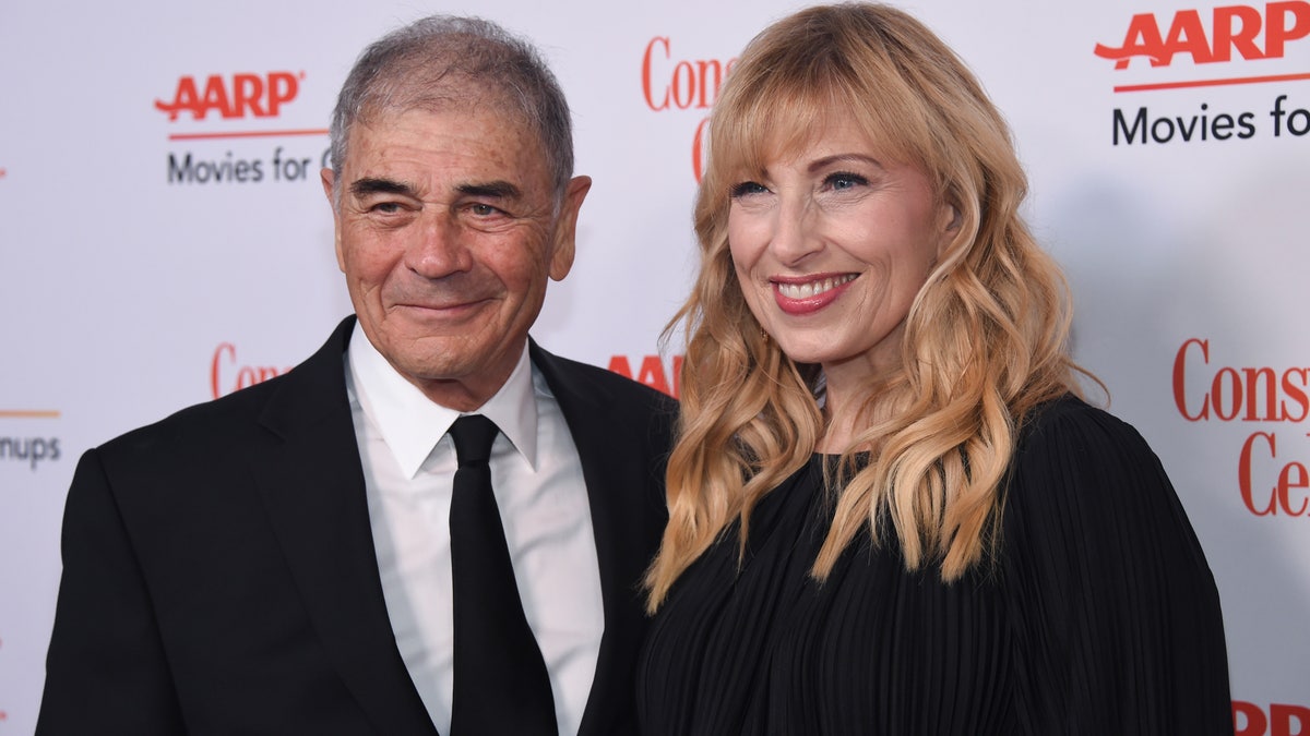 Robert Forster, left, and Denise Grayson attend the 18th Annual Movies For Grownups Awards at Beverly Wilshire Hotel, in Beverly Hills, Calif. Forster, the handsome character actor who got a career resurgence and Oscar-nomination for playing bail bondsman Max Cherry in "Jackie Brown," has died at age 78. Forster's agent Julia Buchwald says he died Friday, Oct. 11, 2019, at home in Los Angeles of brain cancer. (Photo by Phil McCarten/Invision/AP, File)