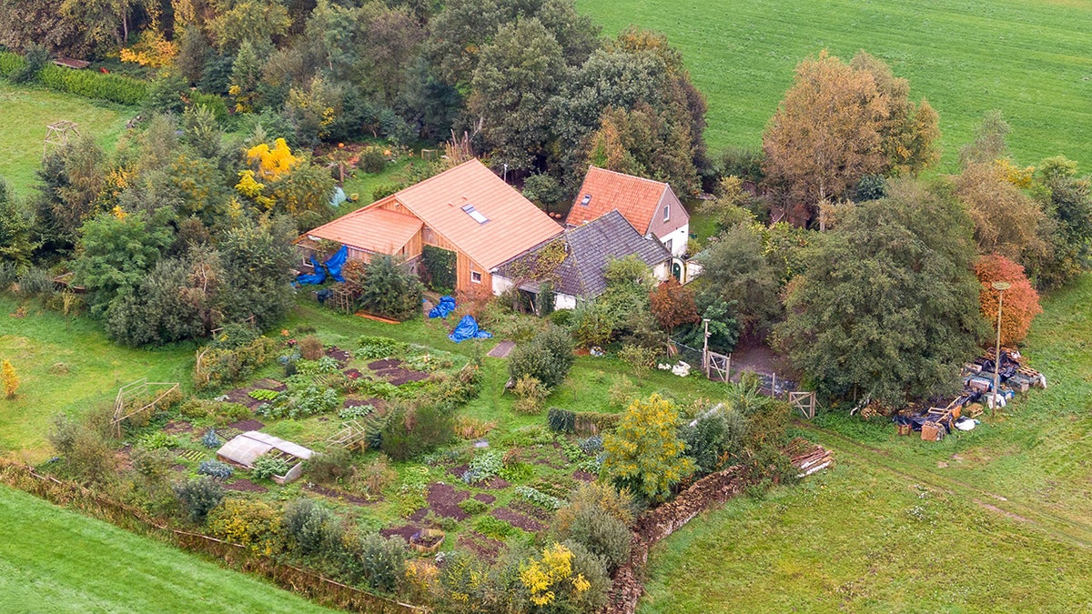 An aerial picture taken on October 15, 2019 shows a view of the farm where a father and six children had been living in the cellar, In Ruinerwold, northern Netherlands.
