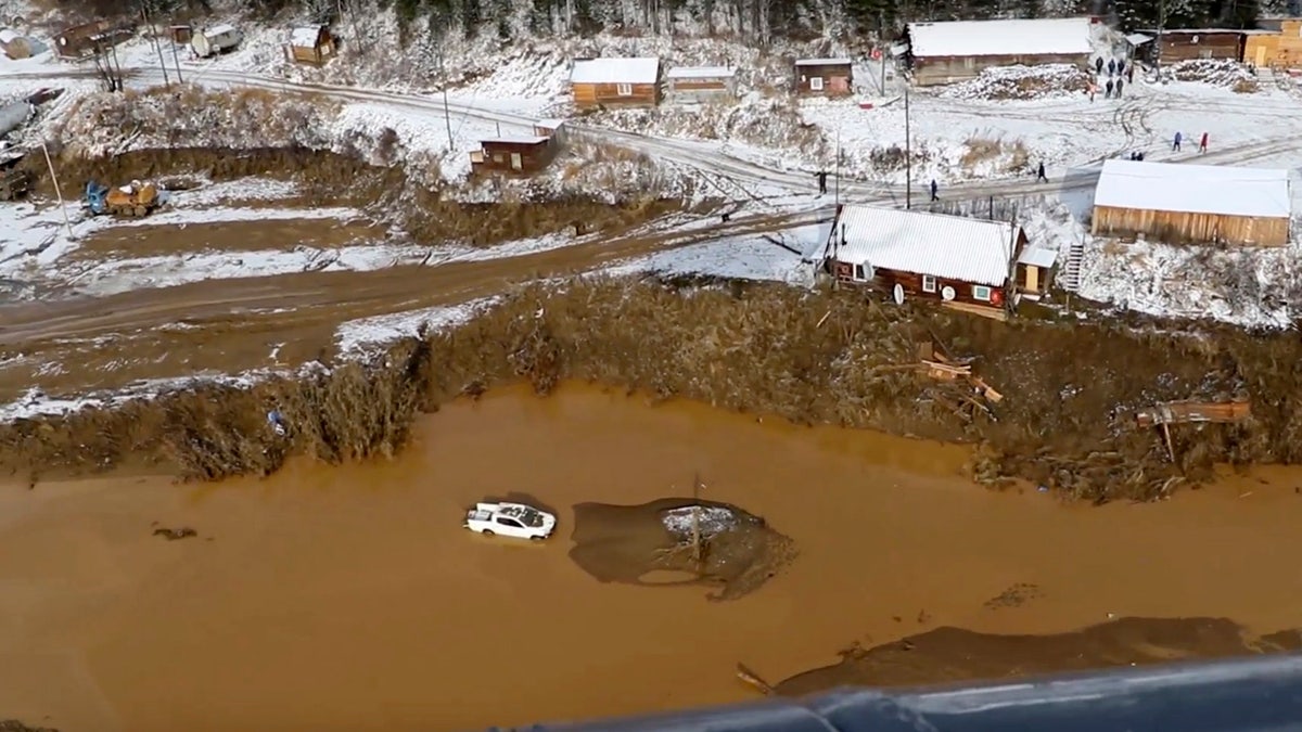 In this image made from video provided by Russian Emergency Situations Ministry press service, a view after the dam collapse during heavy rain on Saturday.