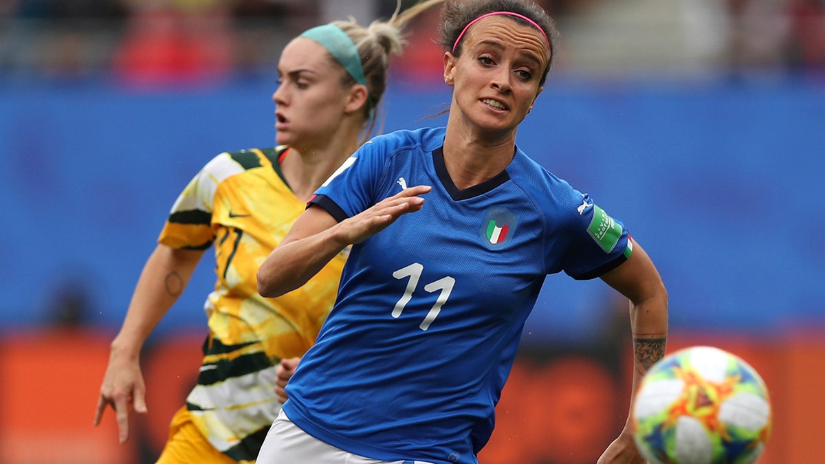 FILE - In this June 9, 2019 file photo, Australia's Ellie Carpenter, left, chases Italy's Barbara Bonansea during a Women's World Cup Group C soccer match between Australia and Italy at the Stade du Hainaut in Valenciennes, France. Italy won 2-0. Italy’s surprise run to the quarterfinals of the Women’s World Cup this year went a long way toward changing misconceptions about the female game in a country where the most popular sport is dominated by men. (AP Photo/Francisco Seco, file)
