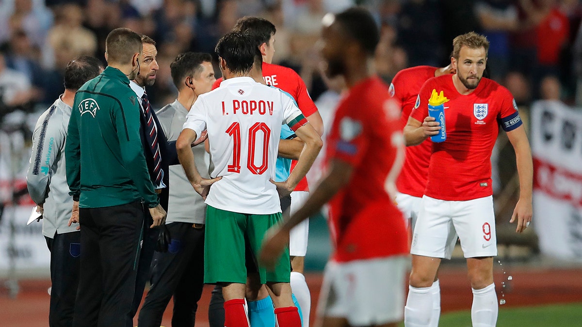 England manager Gareth Southgate, third left, speaks with Referee Ivan Bebek during the Euro 2020 group A qualifying soccer match between Bulgaria and England, at the Vasil Levski national stadium, in Sofia, Bulgaria, Monday, Oct. 14, 2019. (AP Photo/Vadim Ghirda)