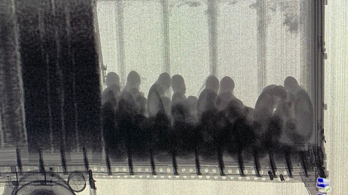 The group was discovered inside the trailer by using X-Rays, which showed dozens locked inside.