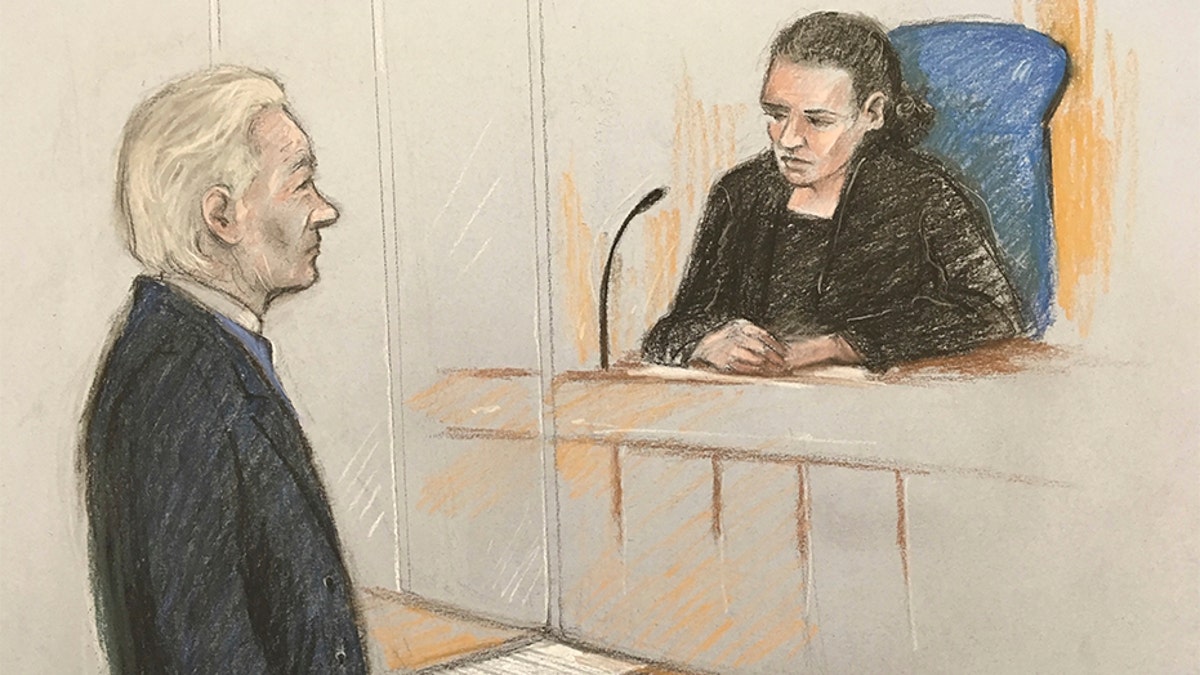 A court artist sketch showing Julian Assange facing District Judge Vanessa Baraitser at Westminster Magistrates' Court in London, on Monday.