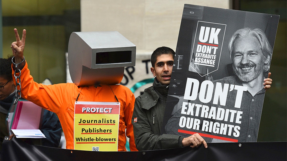 Supporters of Wikileaks founder Julian Assange demonstrate outside Westminster Magistrates' Court in London. (AP)