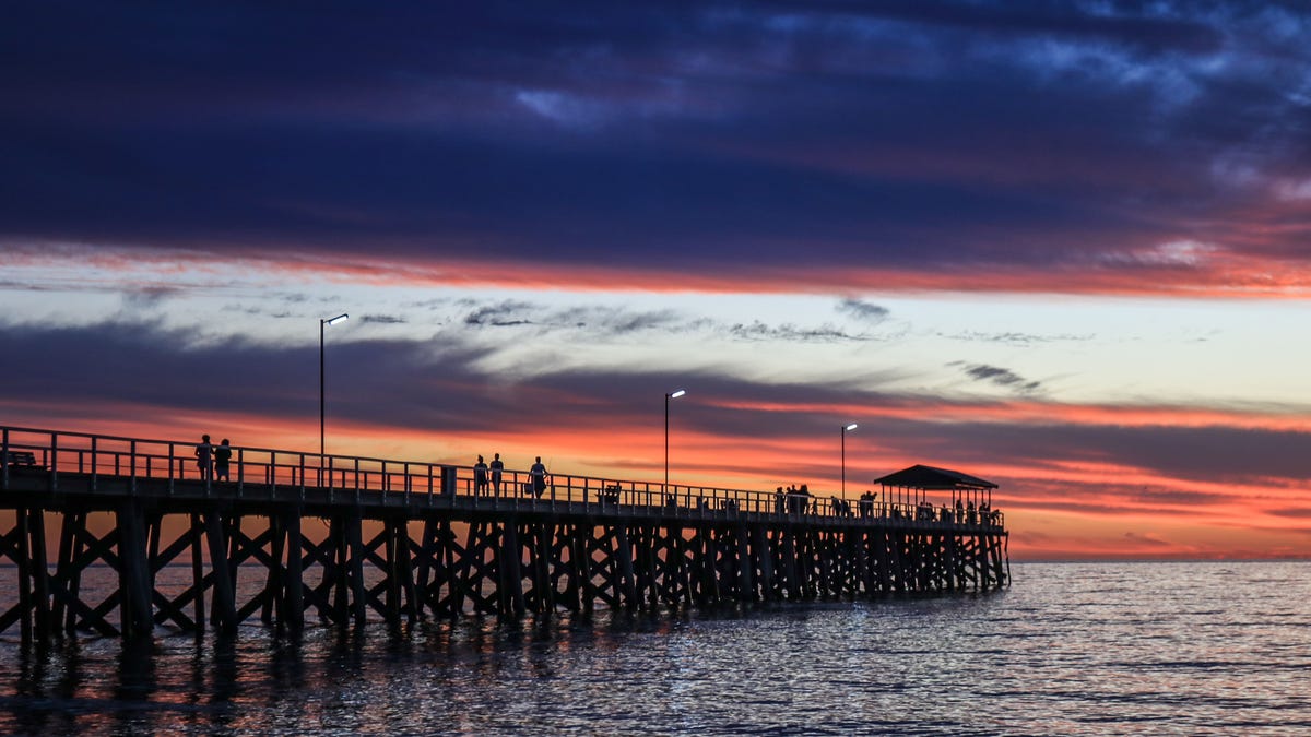 A dramatic sky with stunning colours during sunset over Grange beach in Adelaide (Amer Ghazzal/Barcroft Media via Getty Images)