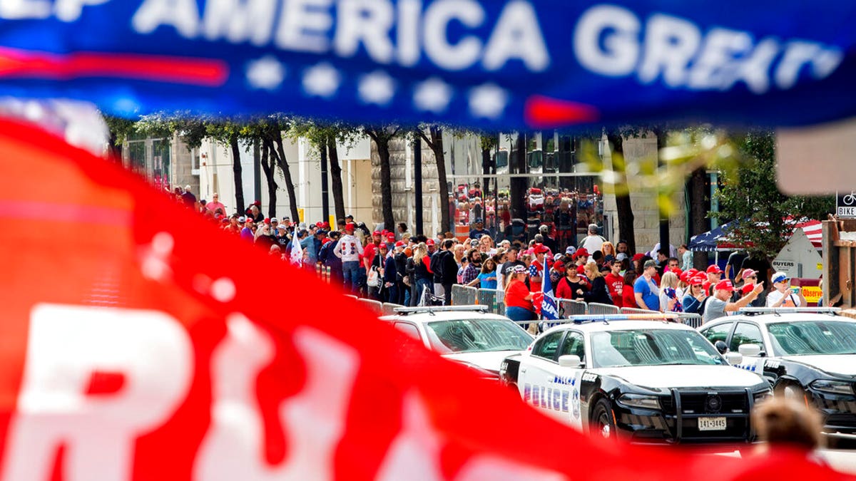 The line to enter the campaign rally for President Trump forming outside the American Airlines Center on Thursday in Dallas. (AP Photo/Jeffrey McWhorter)