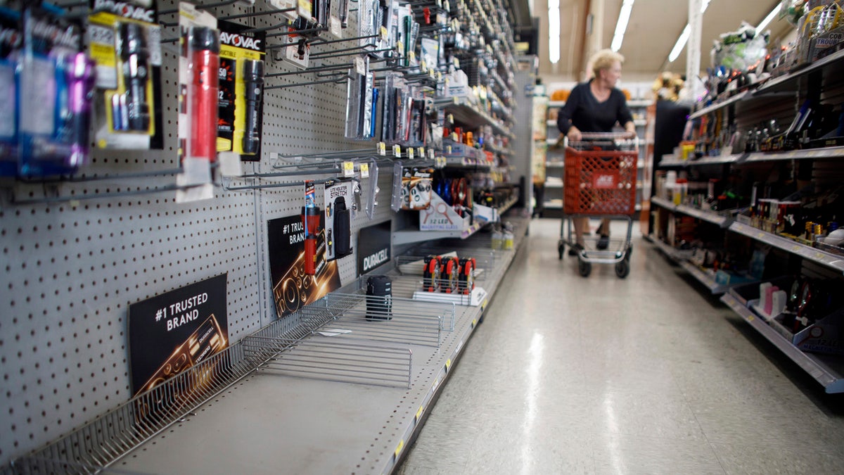 The lantern section is nearly empty at an ACE Hardware store as shoppers prepare for possible power shutoffs in Los Gatos, Calif., Tuesday, Oct. 8, 2019.