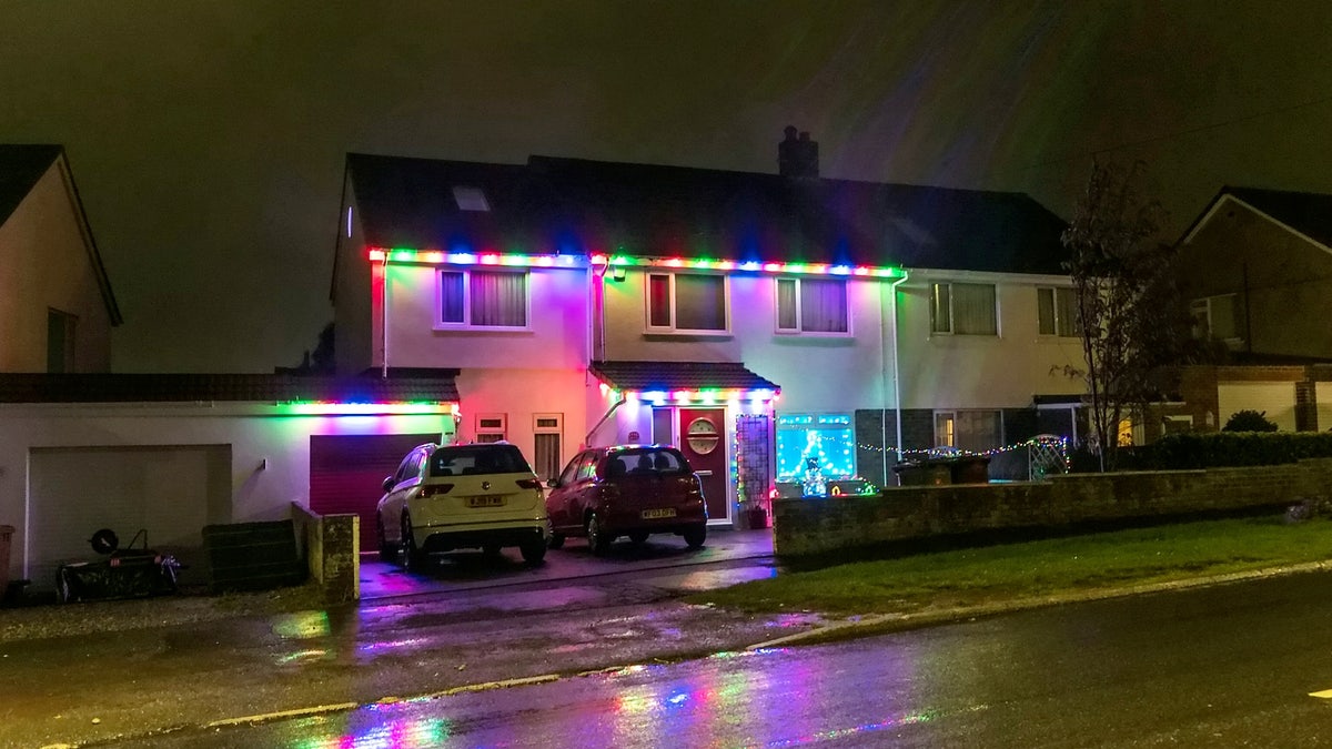 The outside of the family's home is currently decorated with lights and Christmas decorations.